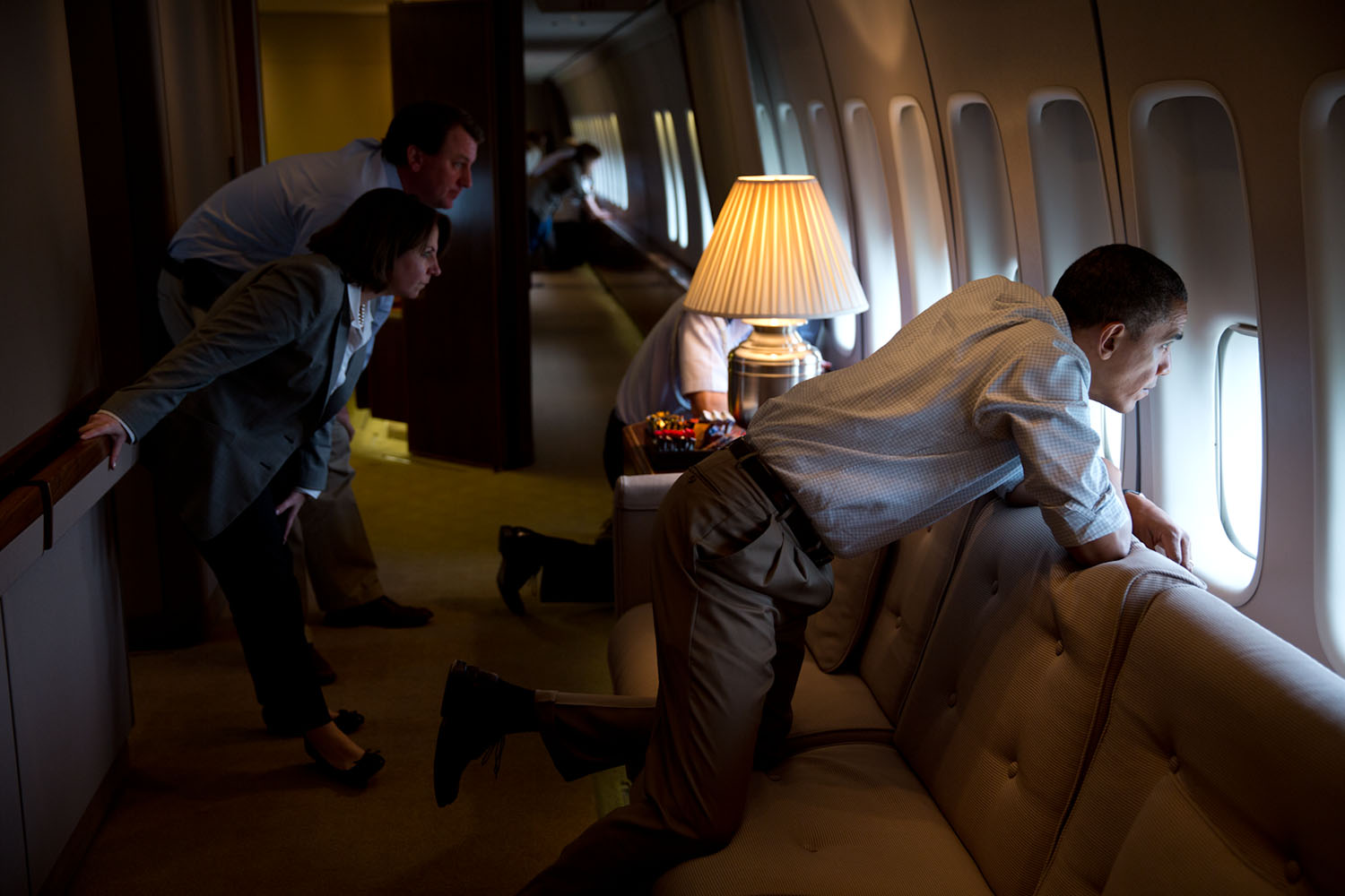 May 26, 2013 "The President and members of the White House staff look out the window of Air Force One to view tornado damage over Moore, Oklahoma. After landing at Tinker Air Base, the President did a walking tour of the damage and met with those affected." (Official White House Photo by Pete Souza) This official White House photograph is being made available only for publication by news organizations and/or for personal use printing by the subject(s) of the photograph. The photograph may not be manipulated in any way and may not be used in commercial or political materials, advertisements, emails, products, promotions that in any way suggests approval or endorsement of the President, the First Family, or the White House.