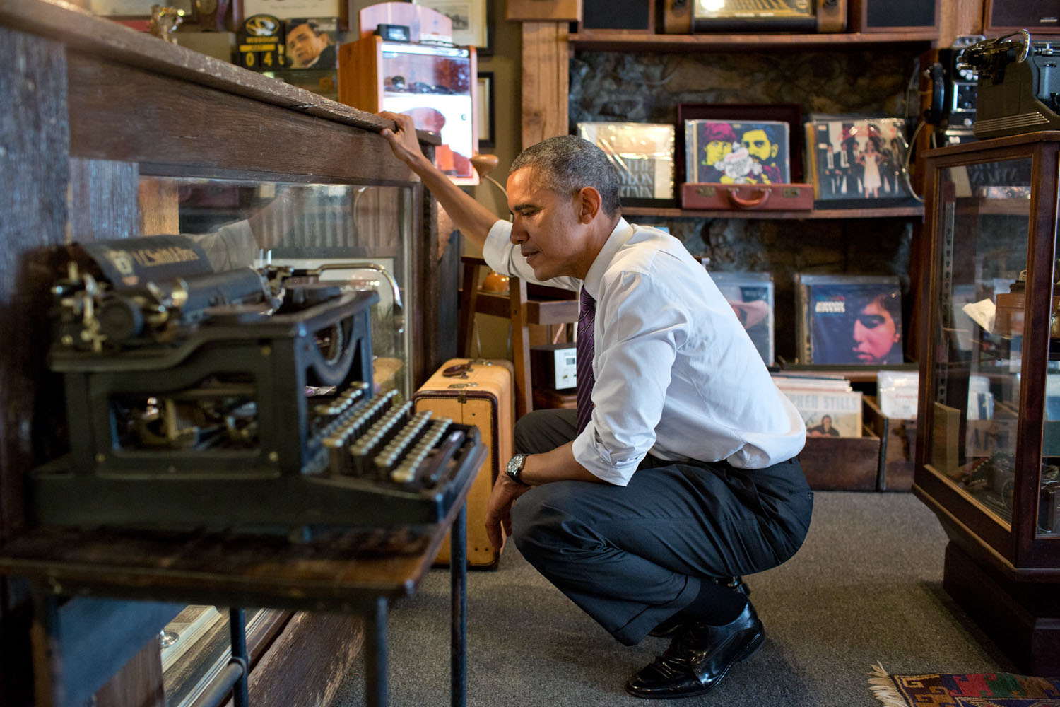 July 30, 2014 "I'm including this photograph because the President just loved looking around at Cool Vintage Watches in Parkville, Missouri. 'A lot of cool stuff,' was how he described it to me afterwards. He said he could have spent a lot more time looking around in the shop, which had much more than just watches." (Official White House Photo by Pete Souza) This official White House photograph is being made available only for publication by news organizations and/or for personal use printing by the subject(s) of the photograph. The photograph may not be manipulated in any way and may not be used in commercial or political materials, advertisements, emails, products, promotions that in any way suggests approval or endorsement of the President, the First Family, or the White House.