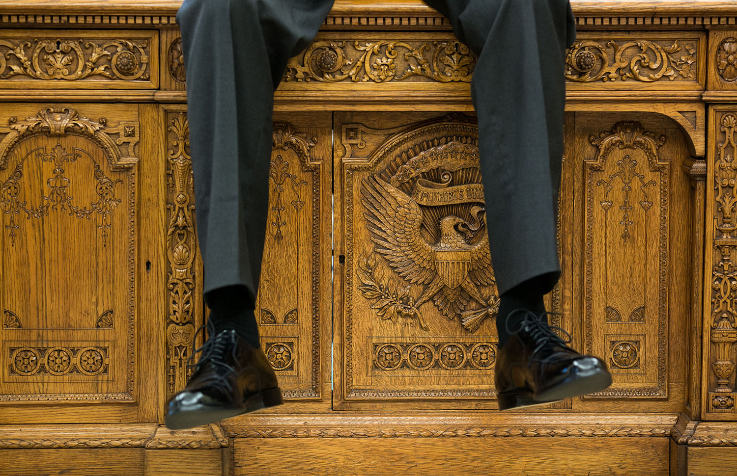 Oct. 1, 2015 "I focused on the detail of the Resolute Desk as the President was talking with two aides in the Oval Office." (Official White House Photo by Pete Souza) This official White House photograph is being made available only for publication by news organizations and/or for personal use printing by the subject(s) of the photograph. The photograph may not be manipulated in any way and may not be used in commercial or political materials, advertisements, emails, products, promotions that in any way suggests approval or endorsement of the President, the First Family, or the White House.