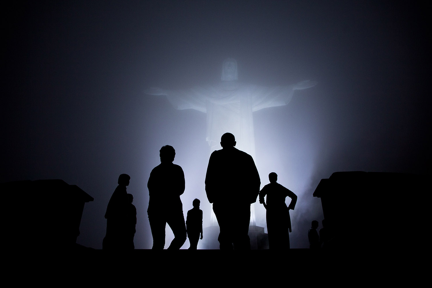 March 20, 2011 "The Obama family was scheduled to tour the Christ the Redeemer statue in Rio before dinner one night. But when heavy fog rolled in, they canceled the visit. After dinner, they the fog had dissipated somewhat so they decided to make the drive up the mountain. It was quite clear when they arrived and then the fog started to roll back in. I managed to capture this silhouette as they viewed the statute one last time just before departure." (Official White House Photo by Pete Souza) This official White House photograph is being made available only for publication by news organizations and/or for personal use printing by the subject(s) of the photograph. The photograph may not be manipulated in any way and may not be used in commercial or political materials, advertisements, emails, products, promotions that in any way suggests approval or endorsement of the President, the First Family, or the White House.