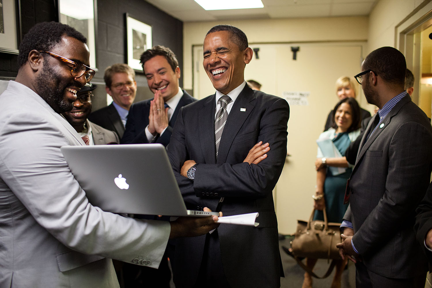 April 24, 2012 "We were backstage at the University of North Carolina in Chapel Hill for the President's appearance on 'Late Night with Jimmy Fallon.' The President let out a big laugh as he was being briefed by the producers and Mr. Fallon on the 'Slow Jam the News' segment." (Official White House Photo by Pete Souza) This official White House photograph is being made available only for publication by news organizations and/or for personal use printing by the subject(s) of the photograph. The photograph may not be manipulated in any way and may not be used in commercial or political materials, advertisements, emails, products, promotions that in any way suggests approval or endorsement of the President, the First Family, or the White House.