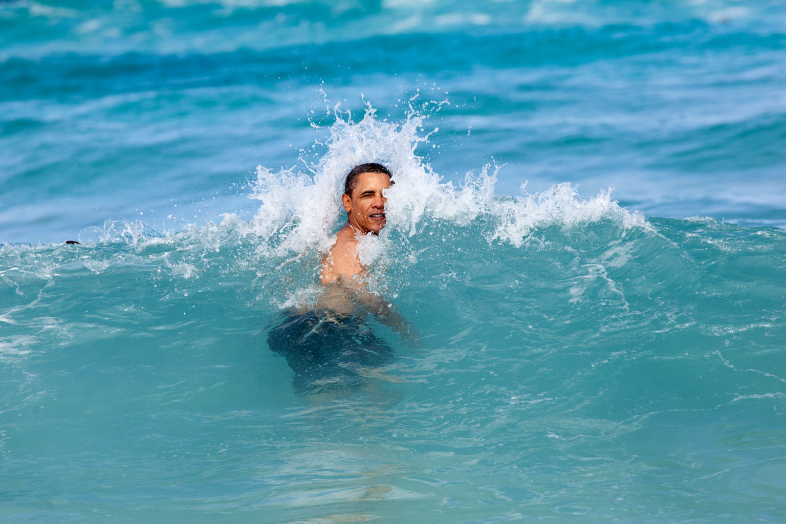 Jan. 1, 2012 "A nice way to celebrate the New Year for the President was to jump in the ocean in his native state of Hawaii. He was on his annual Christmas vacation with family and friends, and went swimming at Pyramid Rock Beach in Kaneohe Bay." (Official White House Photo by Pete Souza) This official White House photograph is being made available only for publication by news organizations and/or for personal use printing by the subject(s) of the photograph. The photograph may not be manipulated in any way and may not be used in commercial or political materials, advertisements, emails, products, promotions that in any way suggests approval or endorsement of the President, the First Family, or the White House.Ê
