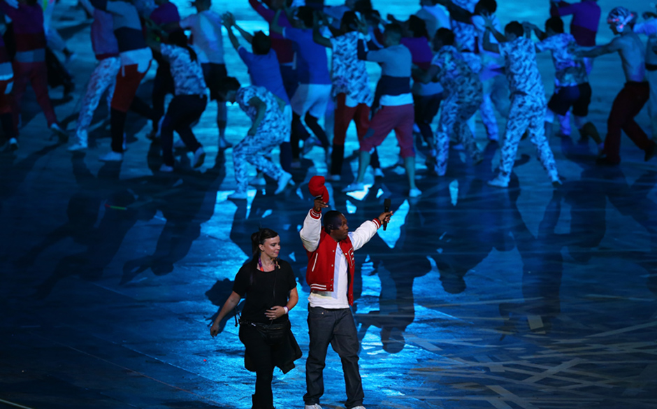 LONDON, ENGLAND - JULY 27:  Performer Dizzee Rascal acknowledges the crowd during the Opening Ceremony of the London 2012 ...