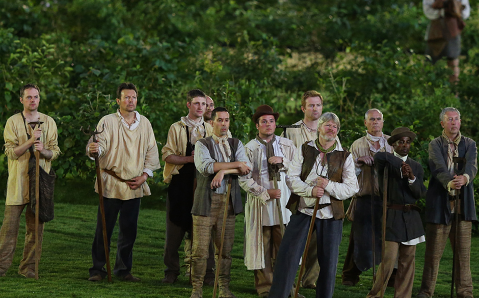 LONDON, ENGLAND - JULY 27:  Performers look on during the Opening Ceremony of the London 2012 Olympic Games at the Olympic...