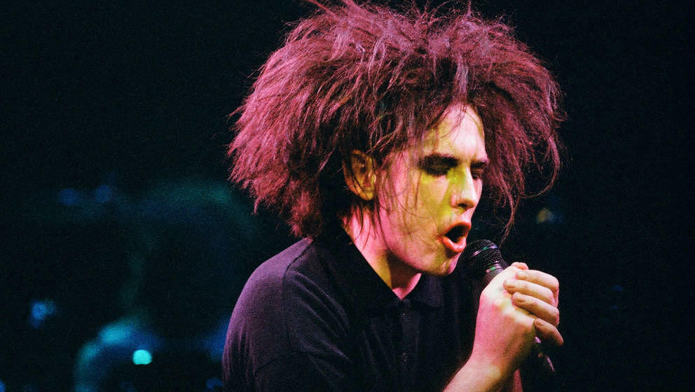 LONDON, UNITED KINGDOM - APRIL 25: Robert Smith of The Cure performs on stage at a benefit concert for Greenpeace, at The Roy