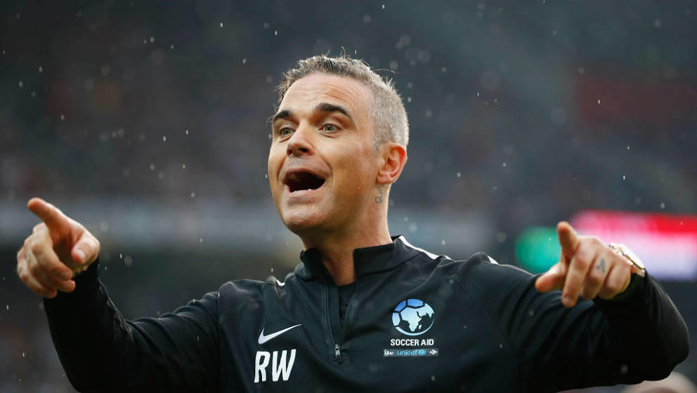 MANCHESTER, ENGLAND - JUNE 10:  Robbie Williams of England looks on prior to the Soccer Aid for UNICEF 2018 match between Eng