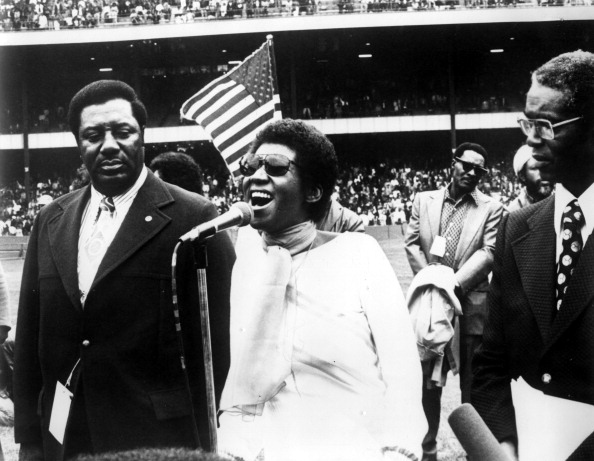 Accompanied by W.H. Toles and Livingston Wingate, Aretha Franklin sings Negro National Anthem at Yankee Stadium, 1976. (Ph...