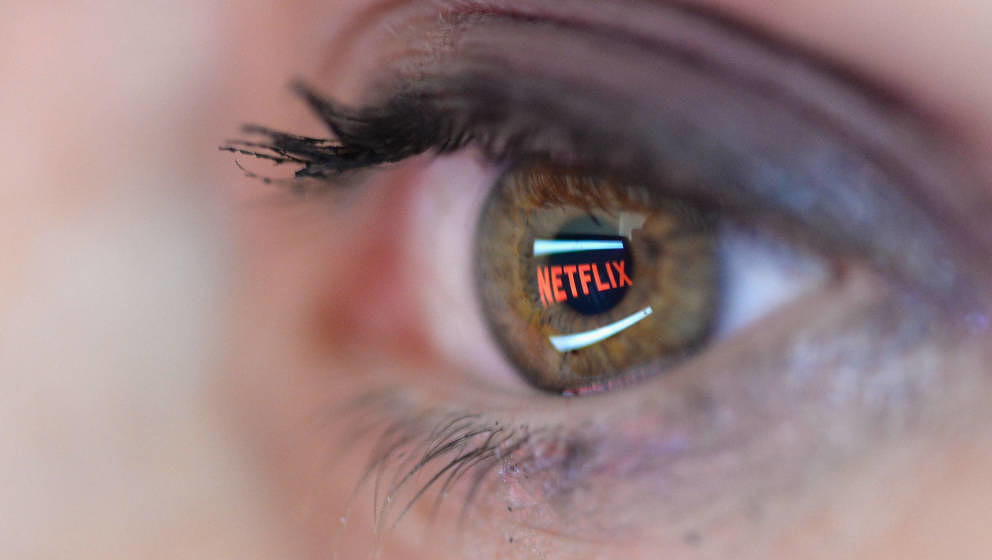 PARIS, FRANCE - SEPTEMBER 19:   In this photo illustration the Netflix logo is reflected in the eye of a woman on September 1