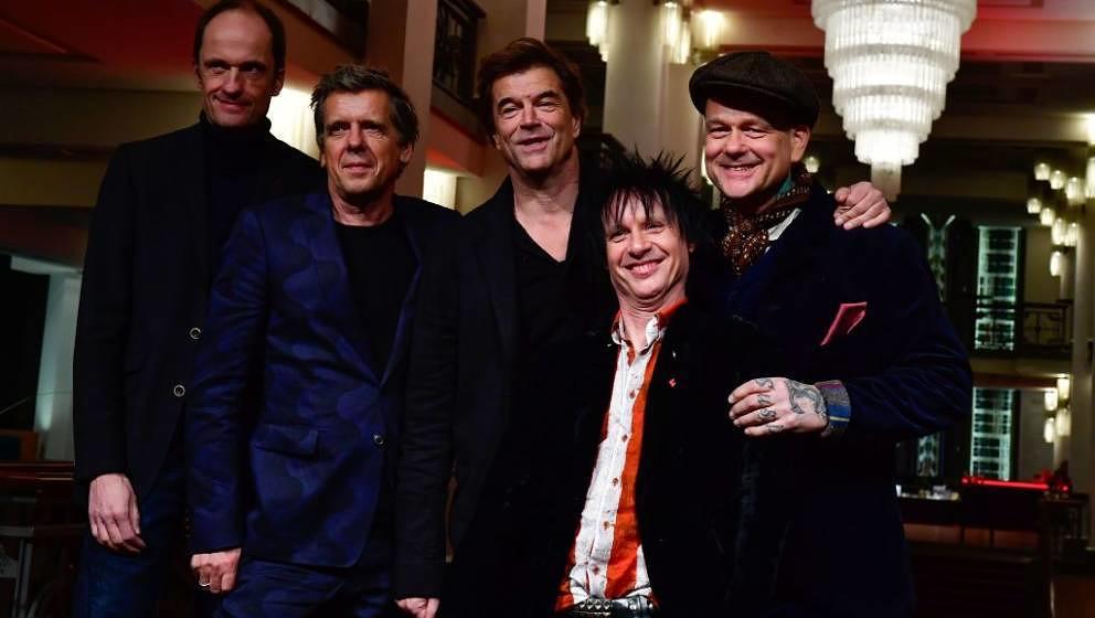 German punk rock band Die Toten Hosen (Campino, Andi, Breiti, Kuddel, Vom) posees on the red carpet before the premiere of th