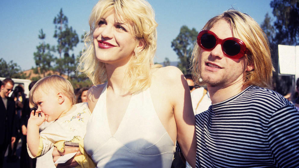 Kurt Cobain of Nirvana (right) with wife Courtney Love and daughter Frances Bean Cobain at the Universal Ampitheater in Unive