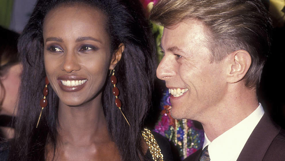 Musician David Bowie and model Iman attend Seventh on Sale AIDS Benefit on November 29, 1990 at the Armory in New York City. 