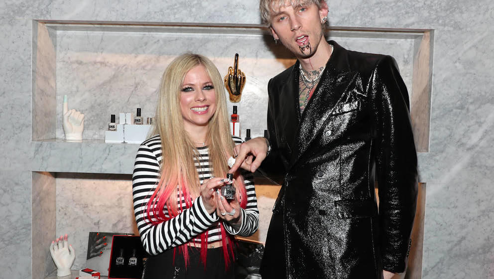 WEST HOLLYWOOD, CALIFORNIA - DECEMBER 04: Avril Lavigne and Machine Gun Kelly attend Machine Gun Kelly's UN/DN LAQR Launch Ev