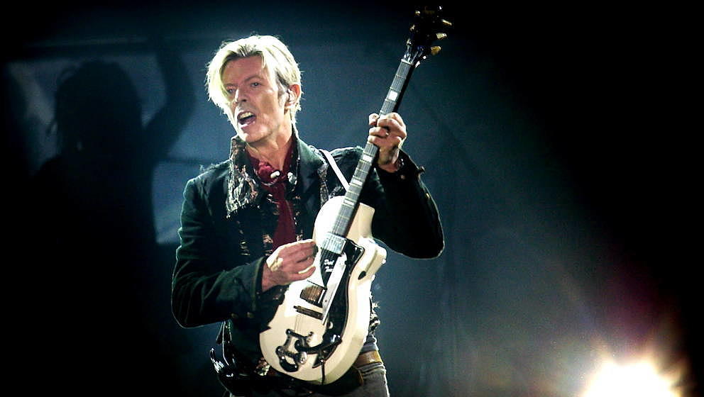 Rock legend David Bowie performs on stage at the Forum in Copenhagen late 07 October 2003. == DENMARK OUT == AFP PHOTO NILS M