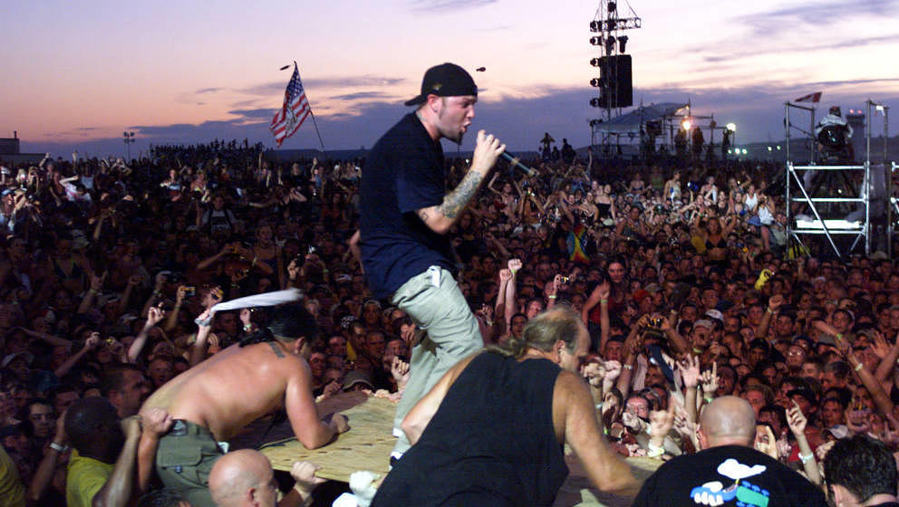 Limp Bizkit's Fred Durst brings his performance to the heads of the crowd of the east stage Saturday at Woodstock '99 in Rome