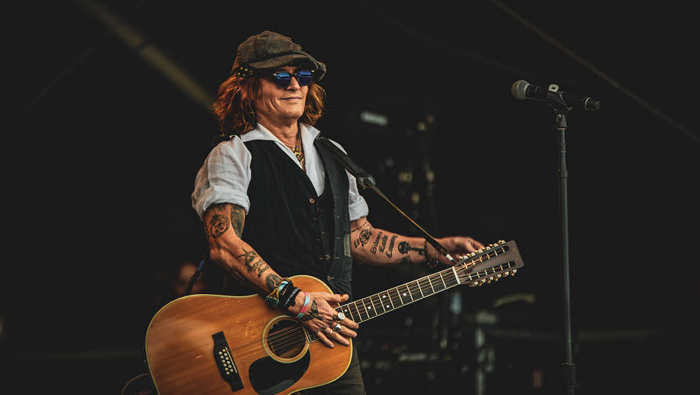 HELSINKI, FINLAND - JUNE 19: Johnny Depp performs on stage with Jeff Beck (not pictured) during the Helsinki Blues Festival a