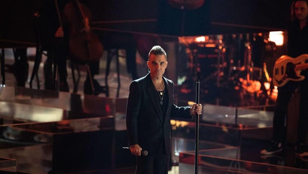 FRIEDRICHSHAFEN, GERMANY - NOVEMBER 19: Robbie Williams performs on stage during the 'Wetten, dass...?' Live Show on November