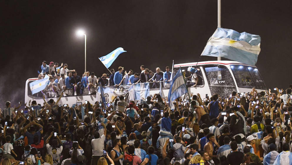 BUENOS AIRES, ARGENTINA - DECEMBER 20: Players of Argentina celebrate with the fans during the arrival of the Argentina men's