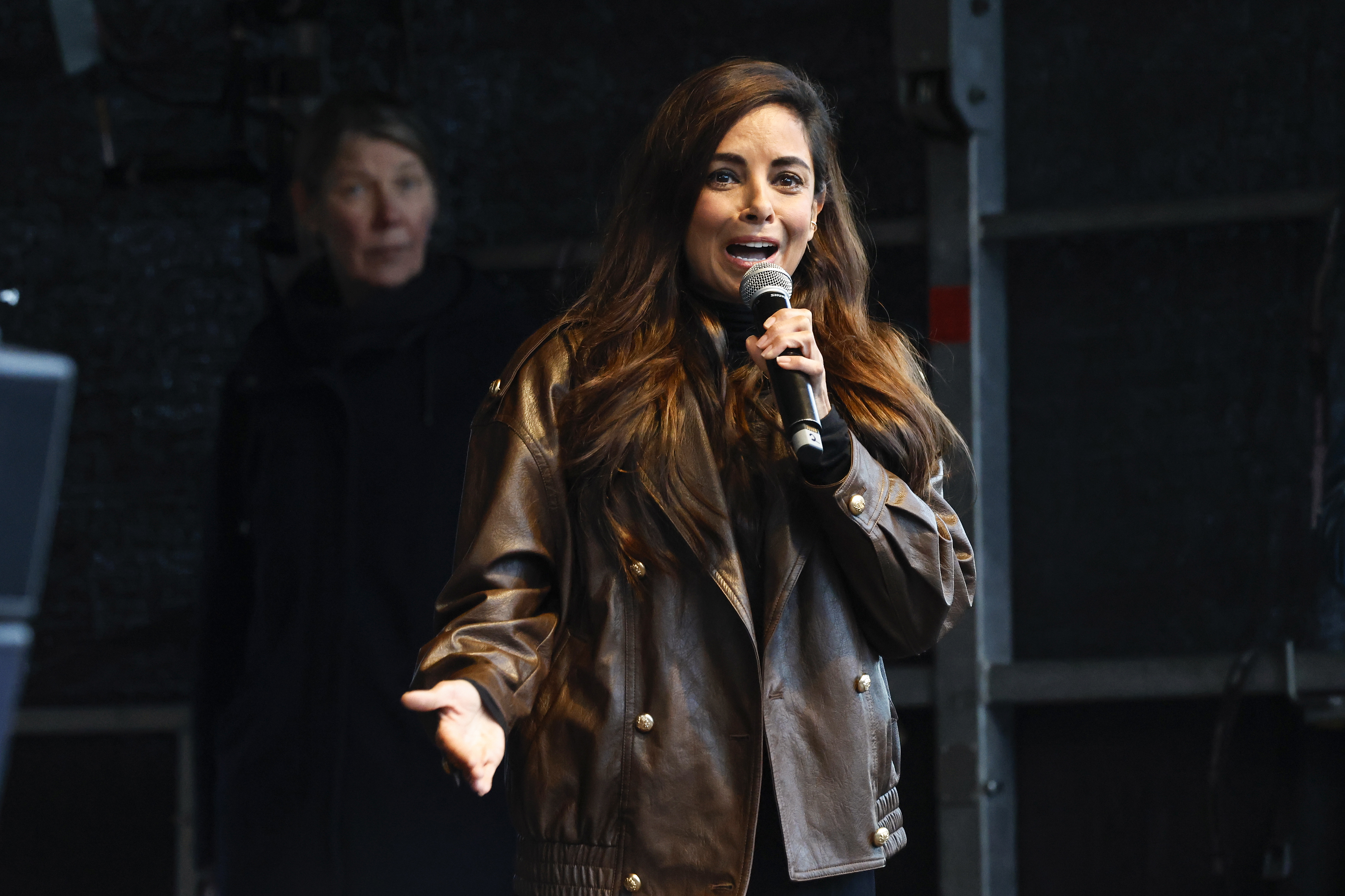 HAMBURG, GERMANY - MARCH 26: Actress and TV host Collien Fernandes speaks as people gather to protest against online aussa...